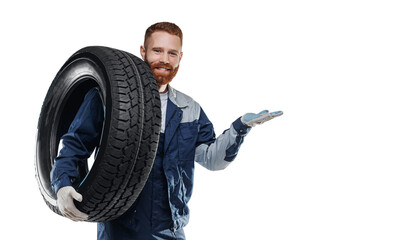 Happy man mechanic hold car tire on isolated white background with copy space © Parilov