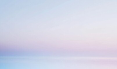Fototapeta premium A calm ocean with a pink and orange sky in the background