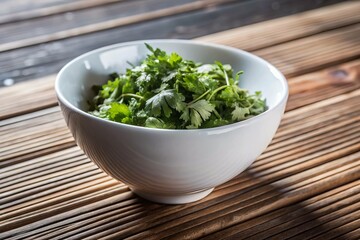 A bowl of green herbs sits on a wooden table