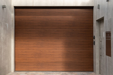 Brown wooden door with texture and concrete entry