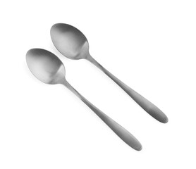 Stainless steel spoons on white background