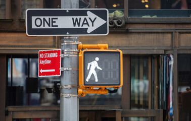One way and no standing anytime signs and traffic light for pedestrians, New York city USA
