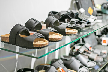 stylish versatile shoes on the shelf in the store. fashion and style