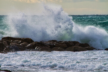 waves breaking on rocks