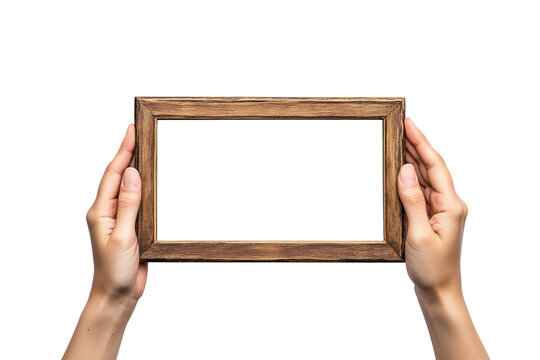 Hands holding wooden frame isolated on a transparent background. PNG file.