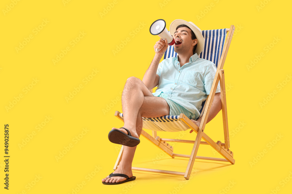 Poster Young man with megaphone shouting in deck chair on yellow background