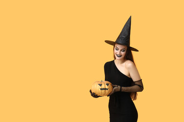 Young woman dressed for Halloween as witch with pumpkin on yellow background