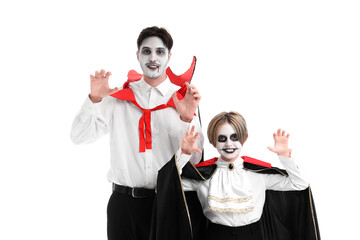 Little boy with his father dressed for Halloween as vampires on white background
