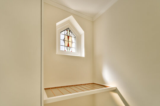 Cozy window nook with stained glass design