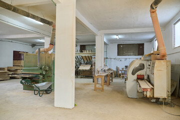 Interior of Wood Processing Industry Featuring CNC Cutting Machines and Wood Processing Equipment