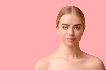 Young woman with beautiful lips on pink background
