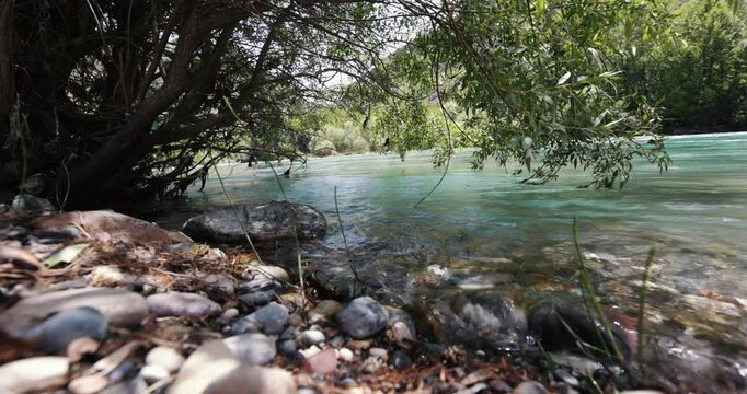 Munzur Stream is a peaceful river view with its clear waters and green tone. It is an ideal option for your nature-themed projects.