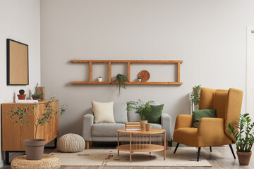 Light living room with brown armchair, cozy sofa, coffee table and chest of drawers