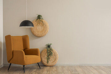 Beautiful living room with brown armchair, houseplant and lamp