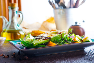 Fresh salad with avocado in a bowl. Healthy vegetarian dish