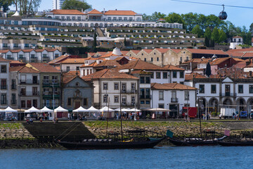 Naklejka premium View of Porto city and Douro river and Dom Luis bridge. Porto, Vila Nova de Gaia, Portugal. Cityscape along the river