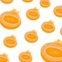 Pieces of orange oval soap with foam on a white background.