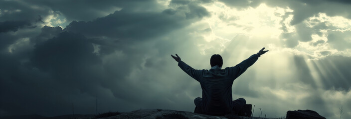 inematic photographs of a young man kneeling down and lifting up his arms high with gratitude to Jesus