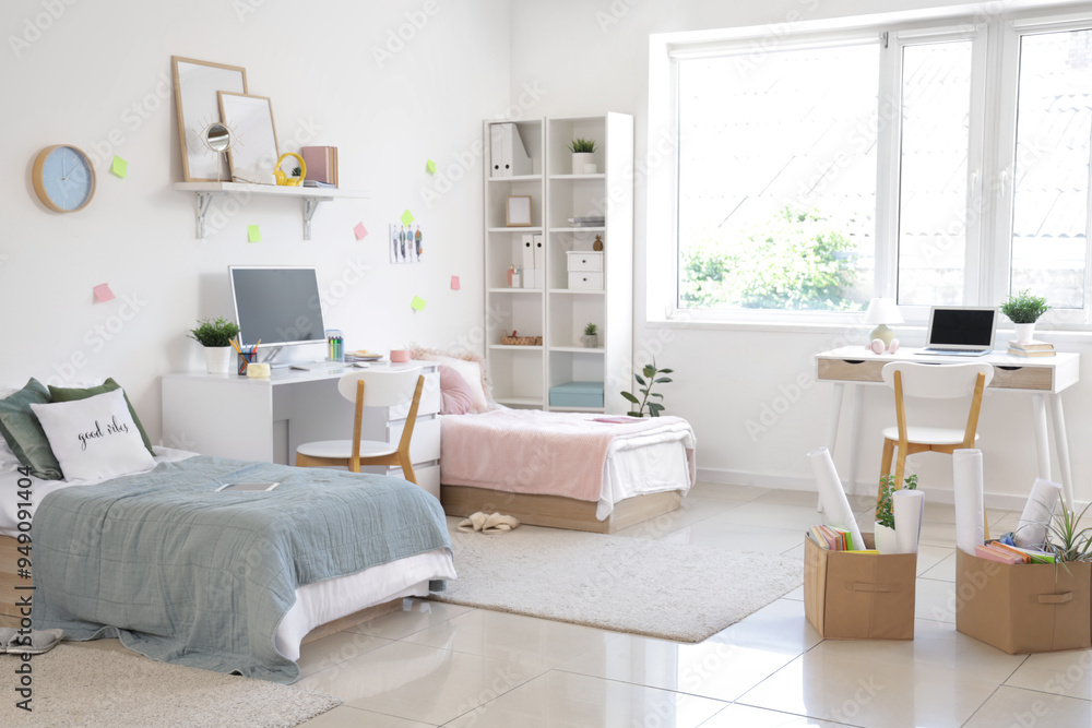 Sticker Interior of dorm room with beds, tables and moving boxes