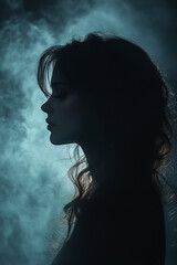 A mystical woman's silhouette in the dark, exuding an enchanting and supernatural aura.