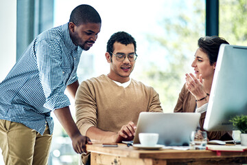 Laptop, office and man with business people in discussion for planning, teamwork and project ideas....