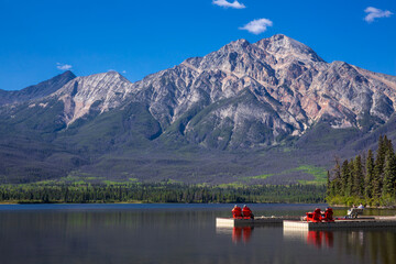 Vacationers relax at Pyramid Lake in Jasper National Park, Alberta, Canada
