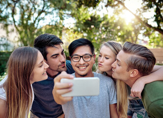 Fototapeta premium Happy people, friends and nature with selfie for photography, memory or outdoor picture together. Young, students or group with smile for friendship moment, inclusion or social gathering at park