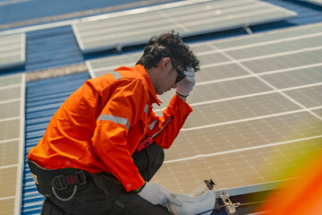 Worker Technicians are working to construct solar panels system on roof. Installing solar photovoltaic panel system. Men technicians walking on roof structure to check photovoltaic solar modules.