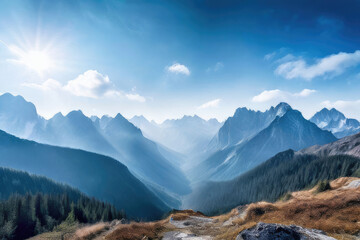 Obraz premium Scenic view of beautiful foggy mountains at sunrise.