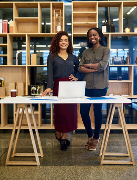 Confident, portrait and women in startup with laptop, web design and business people for discussion. Arms crossed, meeting and intern planning with designer for website or advice at creative company