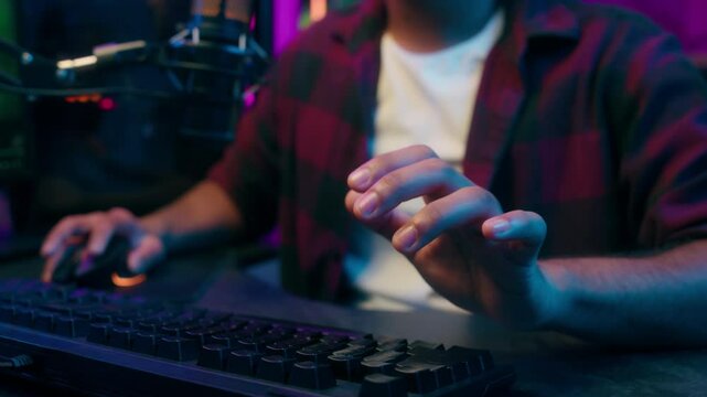 Close up hands Indian Arabian Latino American man keyboard computer control pc network remove headphones turn off end game playing esport relax enjoyment male guy streamer online technology blog vlog