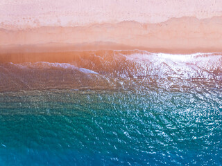 Beautiful sea summer landscape, Waves sea water surface High quality video Bird's eye view, Drone top view waves crashing on sand beach,Nature ocean sea beach background