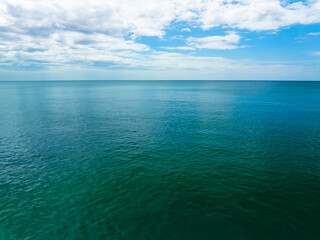 Obraz premium Sea surface aerial view,Bird eye view photo of blue waves and water surface texture Blue sea background Beautiful nature Amazing view sea background