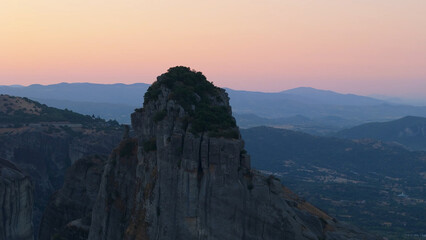 Aerial shot of monasteries built on unique rock formations in the Meteora region of Greece