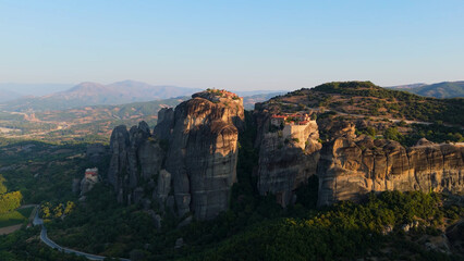 Aerial shot of monasteries built on unique rock formations in the Meteora region of Greece