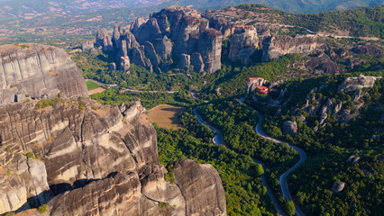 Aerial shot of monasteries built on unique rock formations in the Meteora region of Greece