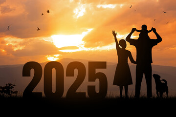 New year 2025 concept.Silhouette of Happy family playing together over sunset with text 2025....