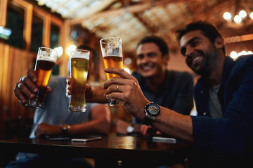 Friends, men and toast with beer at pub for social gathering, communication and relax in...