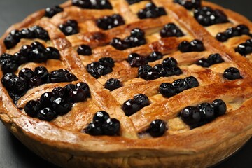 Tasty homemade pie with blueberries on table, closeup