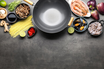 Ingredients for wok on grey table, flat lay. Space for text