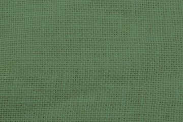 Sage color burlap fabric as background, closeup