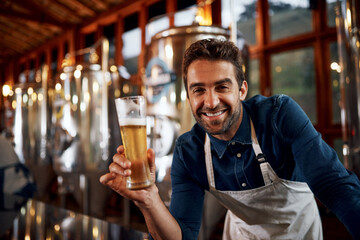 Happy, beer and man brewer in smile for taste of alcohol for quality control production. Portrait, career and business owner with drink for fermentation in factory for oktoberfest in Munich.
