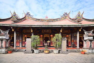 Taiwan - Jan 17, 2024: Detail of the rear hall at Taipei Bao An Temple, featuring single-pitched gabled roof and nine-bay structure with traditional wooden three-pass and five-gua style.