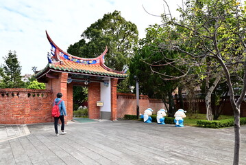 Taiwan - Jan 17, 2024: Visitors walking towards the Ritual Gate at Taipei Confucius Temple, highlighting the traditional respect and ceremonial significance of this entrance.