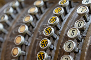 Selective focus, numbers, vintage cash register.