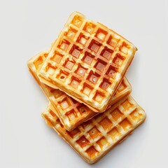 A stack of golden brown waffles, ready to be enjoyed.