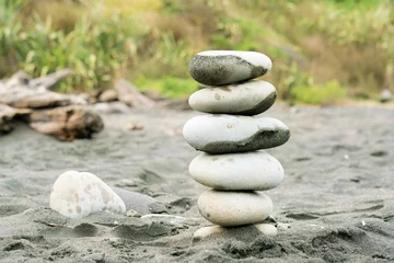 Fotobehang Zen Stenen stack of zen stones on the black sand beach  © Louis