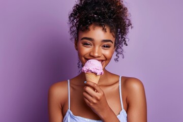 A young woman enjoying a cold treat on a hot day