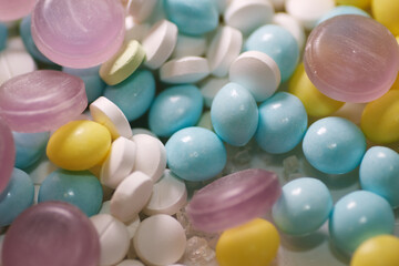 Close up of candy and medicine tablets