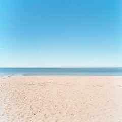 Fototapeta premium Beach Sand with Clear Blue Sky and Ocean